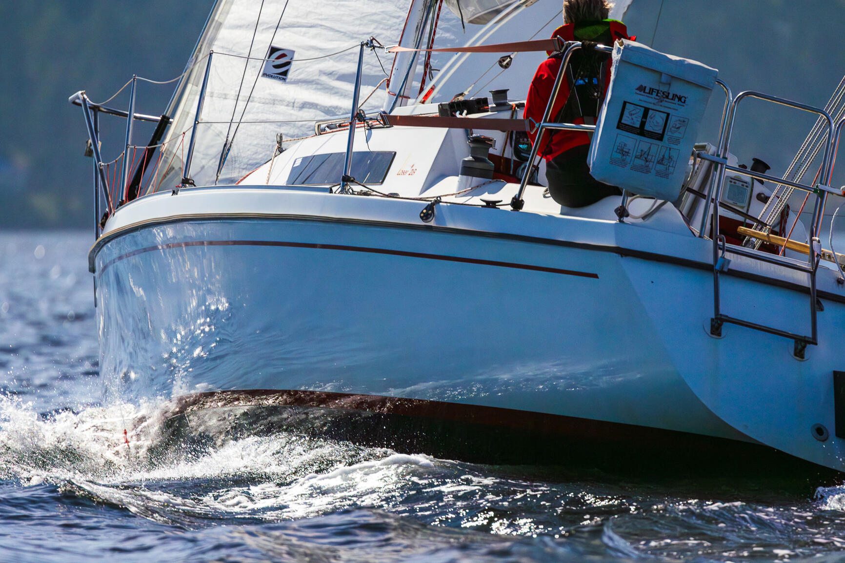 Sloop du Jour, our Laser 28 Sloop du Jour is heeling in a gentle wind. Sailing beautifully as always.